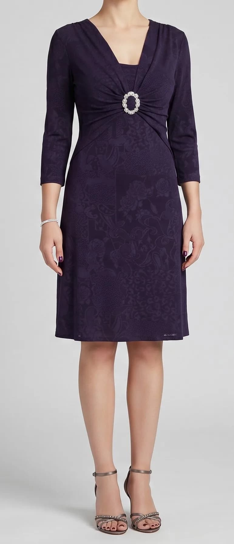 Deep blue knee-length dress with brooch detail